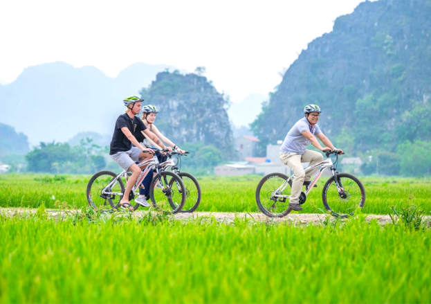 Two wheels, one dream: Cycling through Tam Coc’s scenic valleys