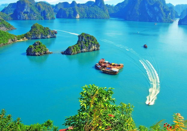 Cruise through the emerald waters and limestone karsts of Lan Ha Bay