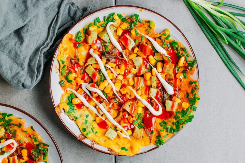 Uncover Vietnamese street food culture with Vietnamese pizza Banh Trang Nuong